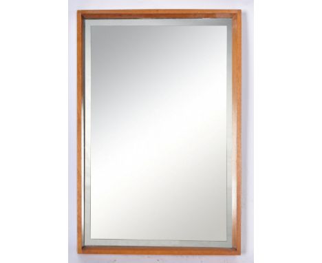 A good quality mid 20th Century retro vintage teak framed wall hanging mirror of simple rectangular form having show wood joi