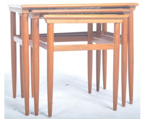 A good set of mid 20th Century Danish retro vintage teak wood and tile topped three nesting tables. The tables graduating in 