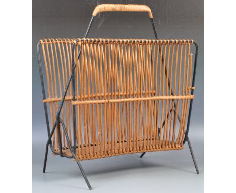 A good mid 20th Century retro vintage wicker and tubular metal magazine rack of simple form. The magrack having a black tubul