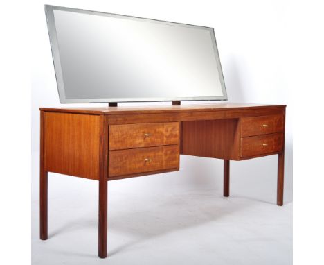 A 20th Century retro vintage twin pedestal kneehole dressing table chest having a large frameless mirrored panel atop over tw