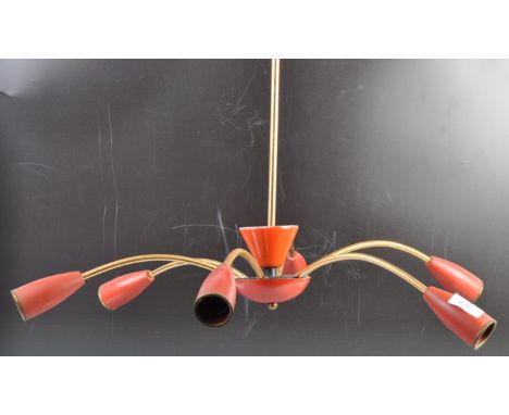 An original retro vintage 20th Century ceiling light fixture comprising of a six arm / branch brass section with red tapered 