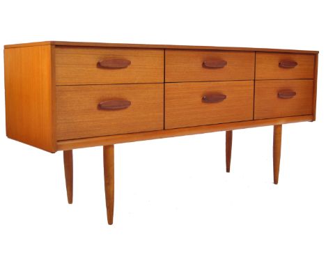 Austinsuite - A mid 20th Century 1960's retro vintage teak wood six drawer sideboard credenza having an arrangement of three 