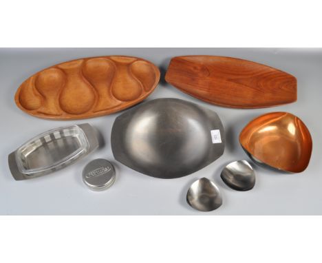 A collection of 20th Century retro vintage Danish stainless steel to include a oval dish raised on tripod legs, pair of candl