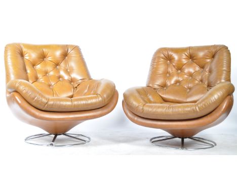 A fabulous pair of mid 20th Century retro vintage Danish inspired egg chairs / easy lounge swivel armchairs. Each chair being