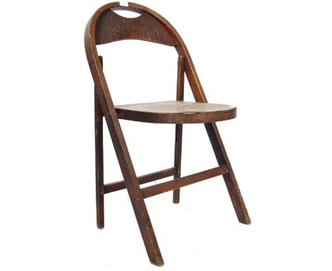 An early 20th Century 1920's Art Deco vintage bentwood fold chair having tortoise shell effect tho the domed backrest and sea