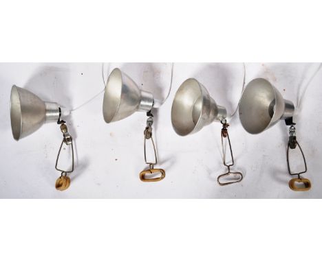 A set of four original vintage retro industrial factory work lights / lamps comprising of brushed steel pendant shades raised