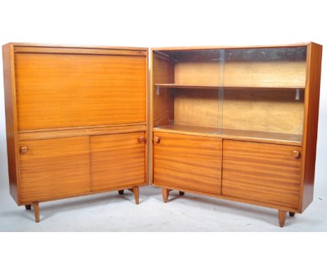 Beaver &amp; Tapley - MW Multi Width Furniture - A pair of 1960s' retro vintage teak wood bookcase display cabinets comprisin