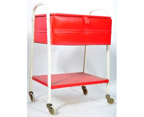 A charming original retro vintage likely German made red and white sewing box. Metal frame construction, with vinyl covered s