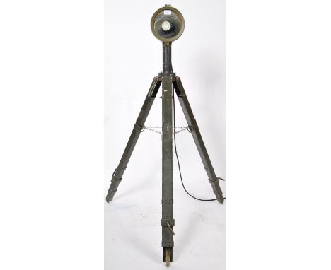 A brilliant 20th Century vintage military issue tripod free standing lamp light having a green finished swivel light atop. Ra