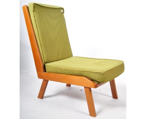 A mid 20h Century retro vintage light oak easy chair / lounge chair having shaped boomerang showood frame sides with green cu