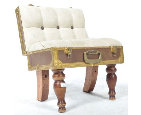 An unusual contemporary small child's seat / low bedroom chair in the form of a suitcase / chest having a upholstered button 