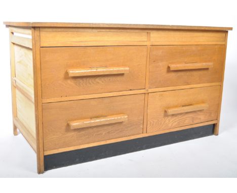A good mid 20th Century retro vintage industrial golden oak plan chest having a large rectangular writing table top with four