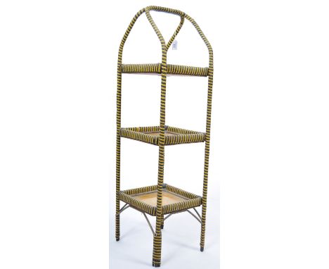 A fabulous 20th Century vintage yellow and black cane three tier cake stand of simple upright rectangular form with corner ri