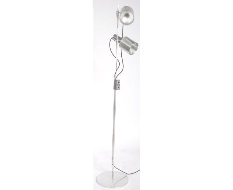 An original 20th Century retro vintage floor standing twin spotlight standard light lamp of polished metal construction. The 