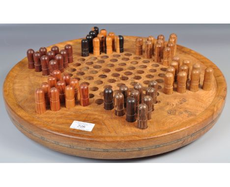 A fantastic early to mid 20th Century Chinese vintage checkers board and gaming pieces. The board made of solid walnut having