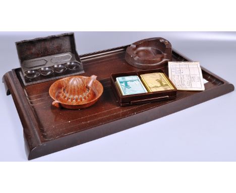 A collection of assorted vintage early 20th Century Art Deco bakelite items to include a large serving tray, pipe stand, lemo