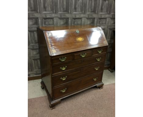 REGENCY MAHOGANY BUREAU, the inlaid fall front opening to reveal an interior fitted with drawers and pigeon holes, over three