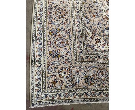 HAND-KNOTTED PERSIAN CARPET, from Kashan, Iran, wool pile, classic floral with central medallion design, predominantly in cre