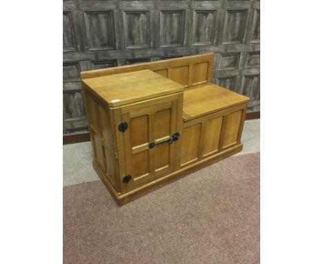 ROBERT 'MOUSEMAN' THOMPSON TELEPHONE TABLE, with panelled door and hinged seat, carved mouse motif, 107cm wide