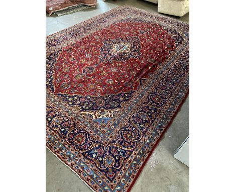 HAND-KNOTTED PERSIAN CARPET, from Kashan, Iran, wool pile, classic floral with central medallion design, 420cm x 290cm