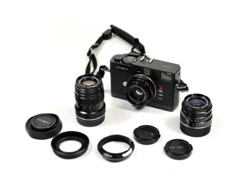A Minolta CLE Rangefinder Camera, with M-Rokkor f/2.8 28mm, M-Rokkor f/2 40mm and M-Rokkor f/4 90mm lenses, together with cap