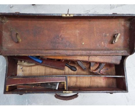A vintage tool chest with contents.