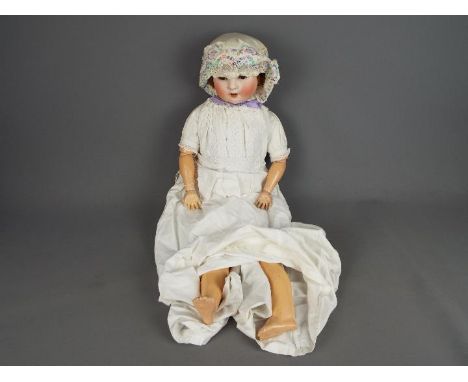 Schoenau & Hoffmeister German bisque headed doll. Makers mark:S (PB inside a star) H 914 11.  Brown open/close glass eyes. Mo