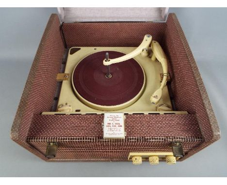 An Ekco mono portable record player with Collaro Conquest turntable and additional stylus.