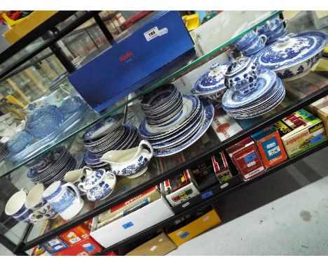 A quantity of blue and white tableware comprising, tureens, plates, side plates, cups, saucers, serving dishes and similar.