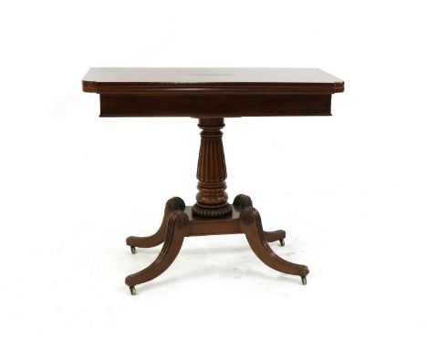 A Regency mahogany pedestal card table, the rectangular break-front top with green baize lining, on a gadroon moulded column,