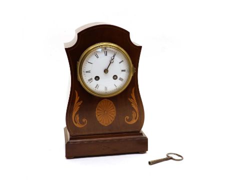 An Edwardian inlaid mahogany mantel clock, with an enamel dial and a French drum movement striking on a gong, 29cm highCondit