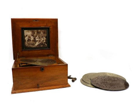 A Polyphon table top musical box, the walnut case with an inlaid panel to the hinged lid, the interior lid with a, probably l