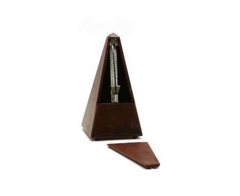 A Maelzel Paquet stained wooden pyramid metronome, raised on bun feet, complete with weighted pendulum, in working order, 11c