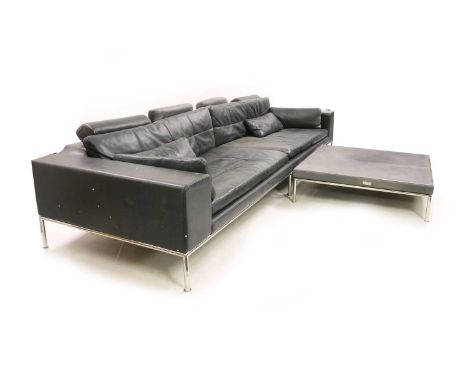 An Italian ‘Contempo’ leather sofa and matching coffee table, the black leather having chrome slender supports, 315cm wide, 7