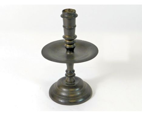 PRICKET CANDLESTICK. A late 17th century Heemskerk cast brass candlestick. The socket with two filled holes & fitted with an 