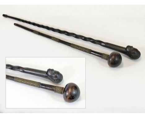 AFRICAN STICK ETC. An African hardwood walking cane carved with a head, 96cm. Also, a knobkerrie, the shaft decorated with fo