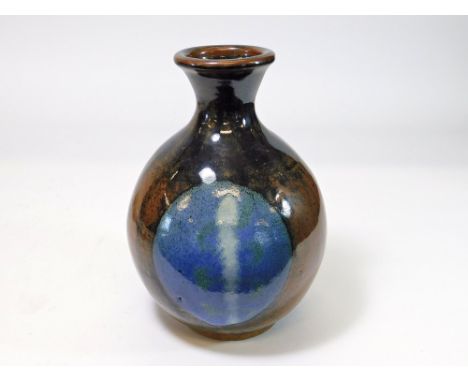 TREVOR CORSER. A Trevor Corser bottle vase decorated on opposite sides with a large circle. Height 26cm Impressed personal & 