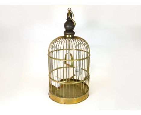 BIRD CAGE. A vintage brass bird cage with ceramic feeders. Full height 74cm.  Please note that all items in this auction are 