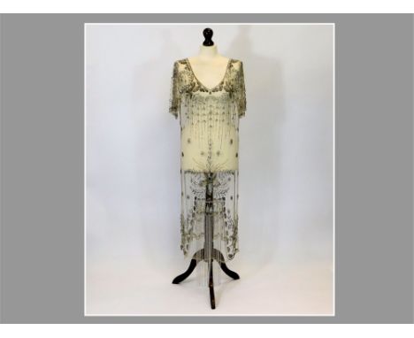 BEADED DRESS. An Art Deco heavily beaded & sequinned over-dress, embroidered with iridescent sequins & grey tubular beads for