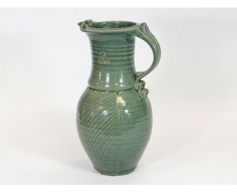 JOHN VASEY. A John Vasey, St. Agnes Pottery pitcher. Height 33cm. Impressed mark.  Please note that all items in this auction