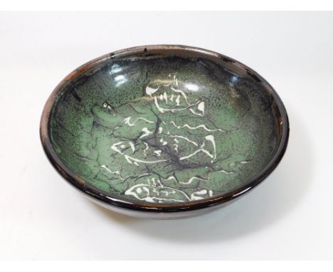 TREVOR CORSER. A large Trevor Corser bowl decorated with slip trailed fish. Diameter 34cm Impressed personal & Leach Pottery 