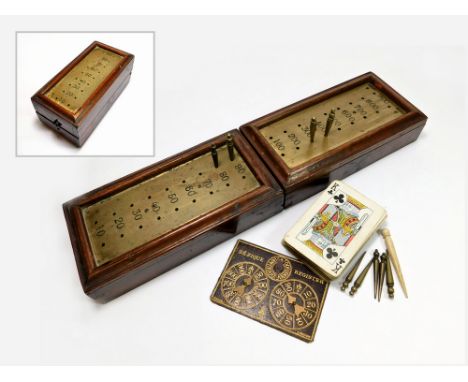 CRIBBAGE BOX. A heavy brass & mahogany cribbage box with nine brass pegs & one bone peg etc. Length when opened 38cm.  Please