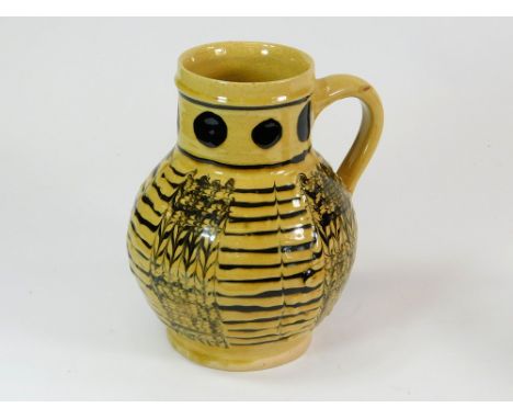 JOHN HUDSON. A slipware pitcher with feathered decoration by John Hudson. 'H' mark. Height 20cm.  Please note that all items 