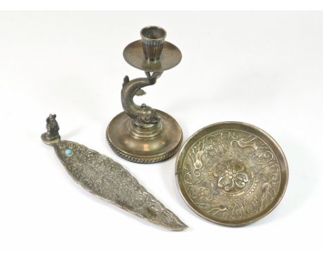 CANDLESTICK ETC. A white metal dolphin candlestick, height 14cm. Also, a white metal small dish, possibly South East Asian & 