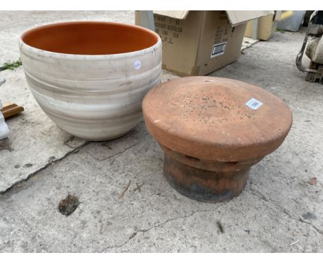 A TERRACOTTA PLANTER AND A CHIMNEY POT TOPPER