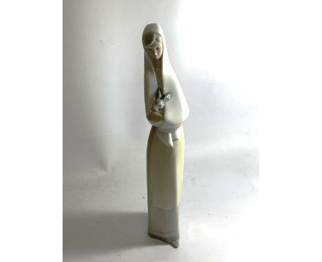 A NAO FIGURINE OF A LADY HOLDING A RABBIT
