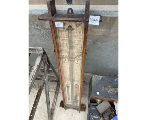 A VINTAGE OAK CASED BAROMETER