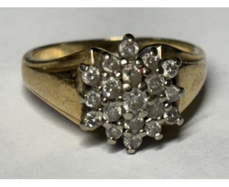 A MARKED 9 CARAT GOLD RING WITH NINETEEN DIAMONDS IN A CLUSTER SIZE K