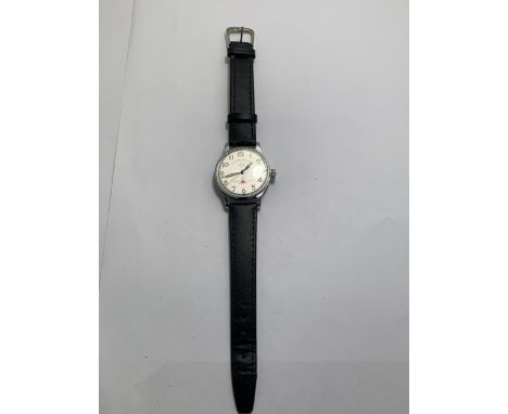 A VINTAGE CCCP RUSSIAN WRIST WATCH WITH BLACK LEATHER STRAP SEEN WORKING BUT NO WARRANTY GIVEN