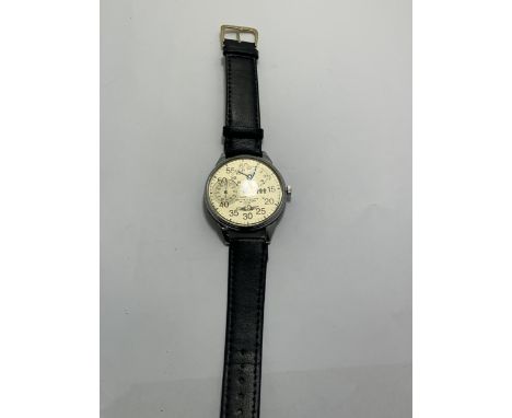 A VINTAGE CCCP RUSSIAN WRIST WATCH WITH BLACK LEATHER STRAP SEEN WORKING BUT NO WARRANTY GIVEN